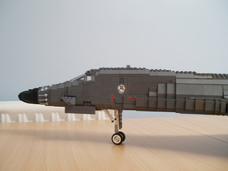 Illustration for article titled Giant LEGO B-1B Bomber Escorted by Fighters, Hawkeye Aircraft
